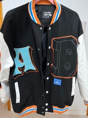 Aelfric Eden Black & White Varsity Jacket with Blue and Orange Accents